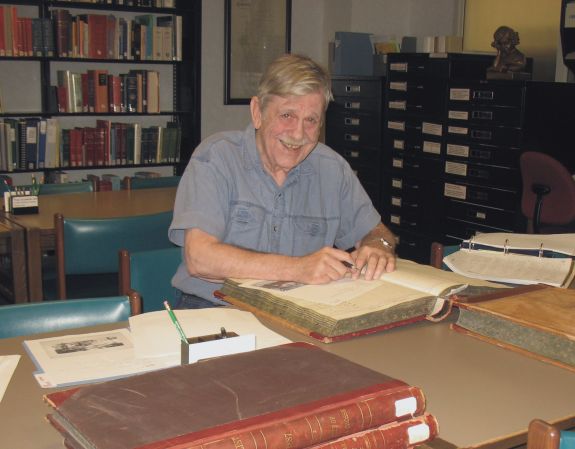 les crocker sitting in archives reading room doing research